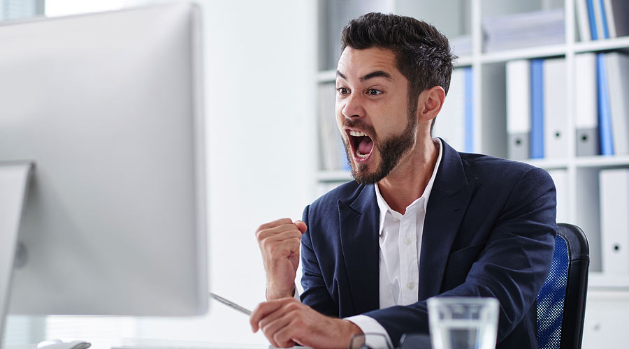 A man far, far too excited to be using a computer. Like, it's fine, dude. Calm down. These are normal now. This isn't Flintstones Meets The Jetsons.